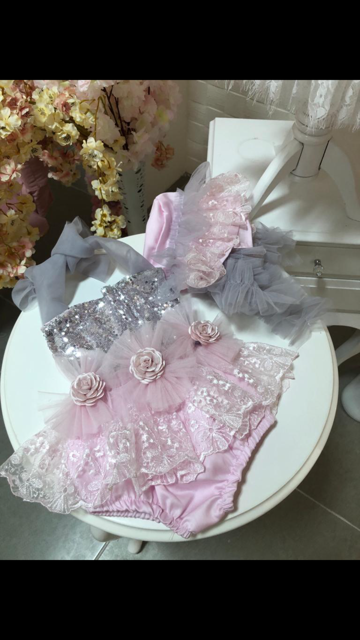 Pink baby romper and bonnet