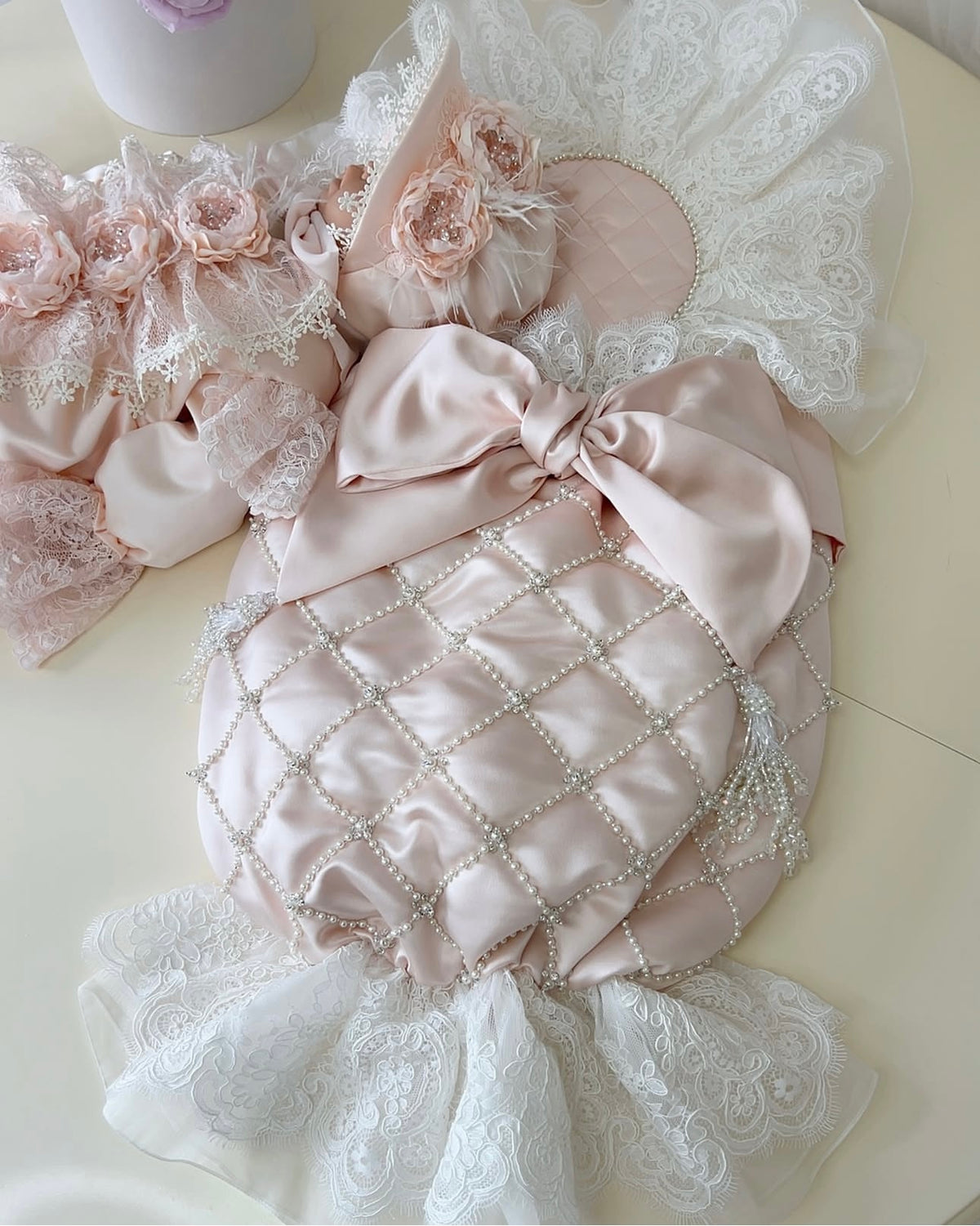 Light pink baby jumpsuit swaddle bonnet and shoes