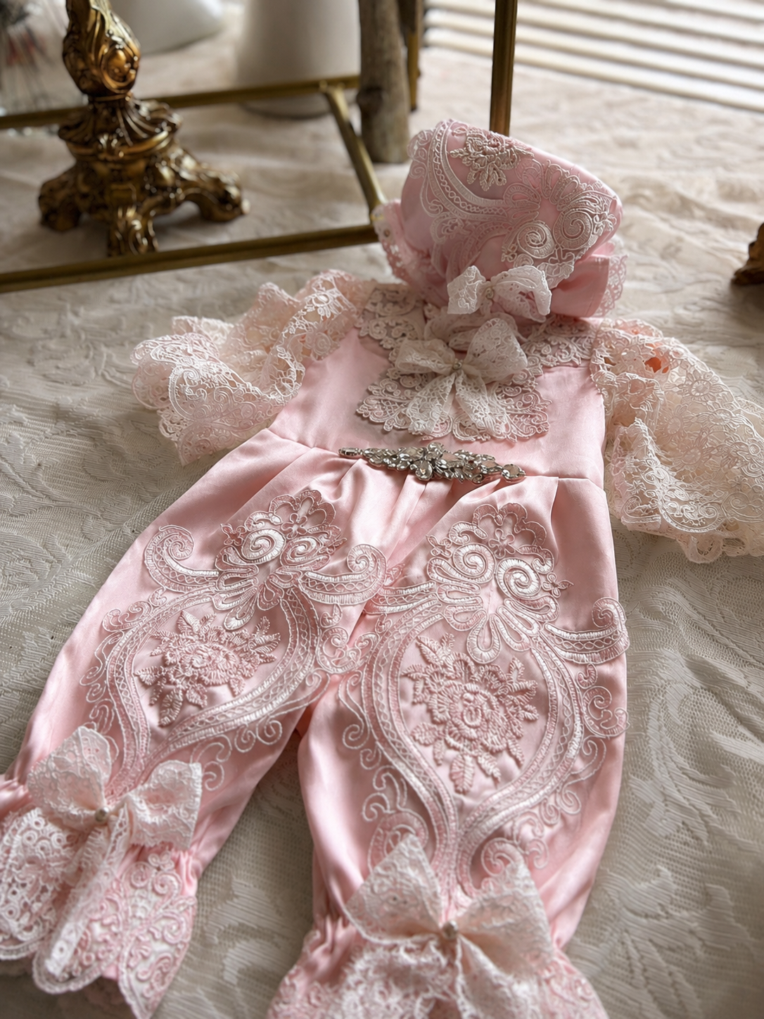 Pink baby jumpsuit and bonnet