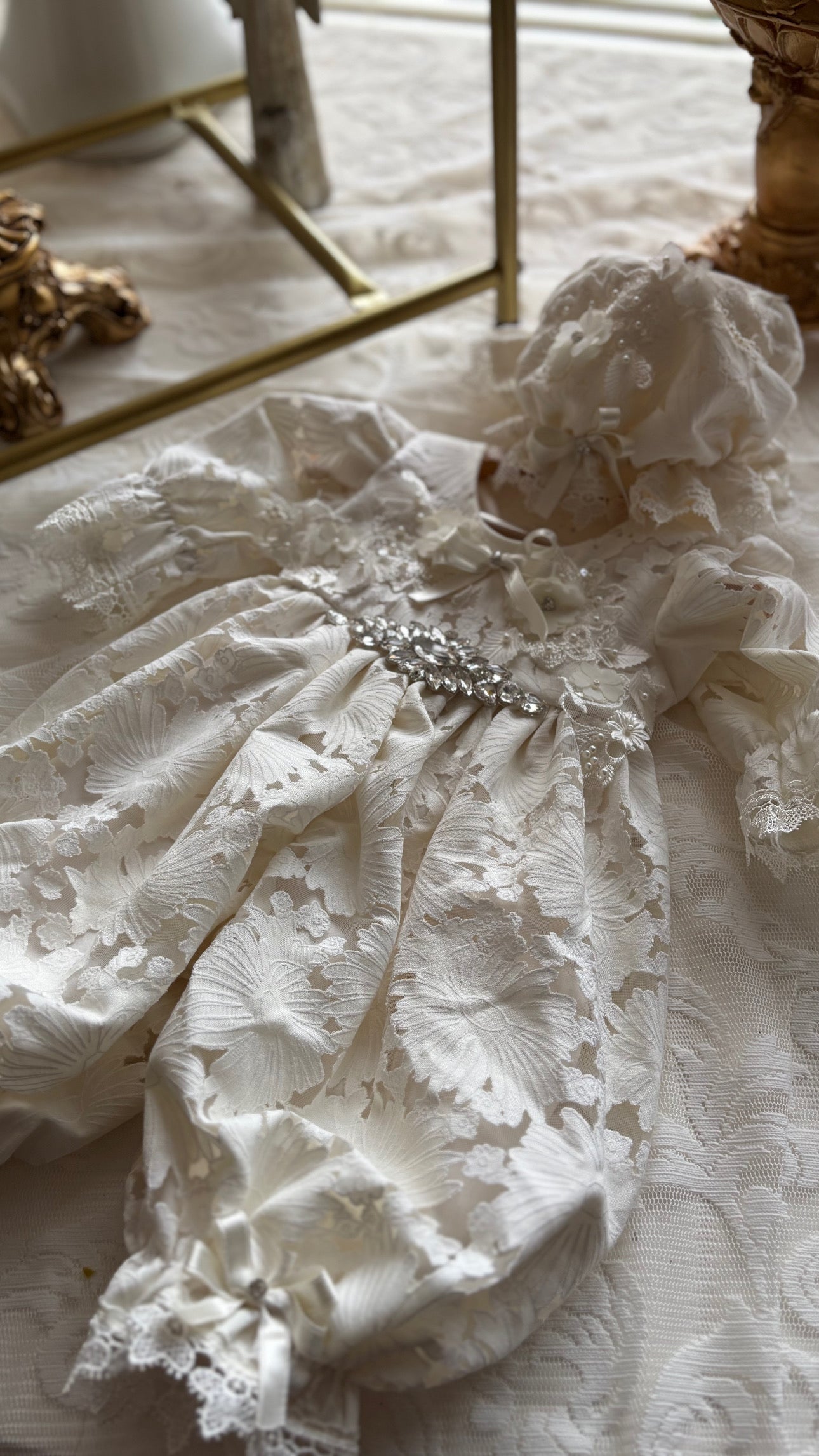 Cream baby jumpsuit and bonnet