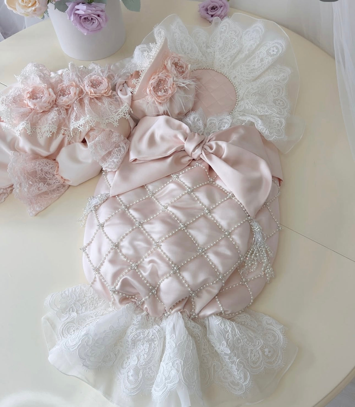 Light pink baby jumpsuit swaddle bonnet and shoes