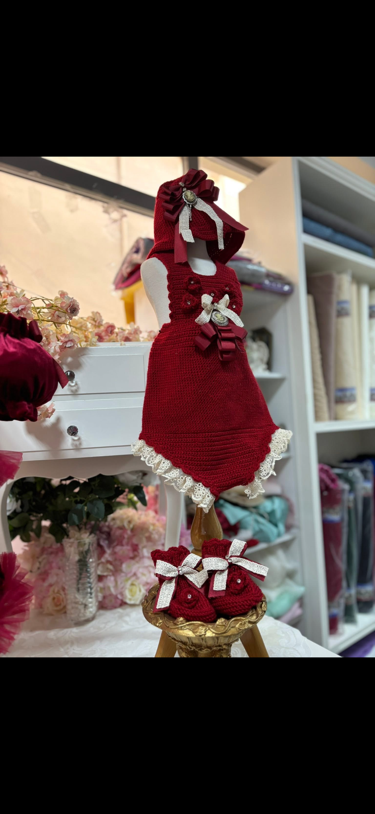 Red knitwear romper and bonnet