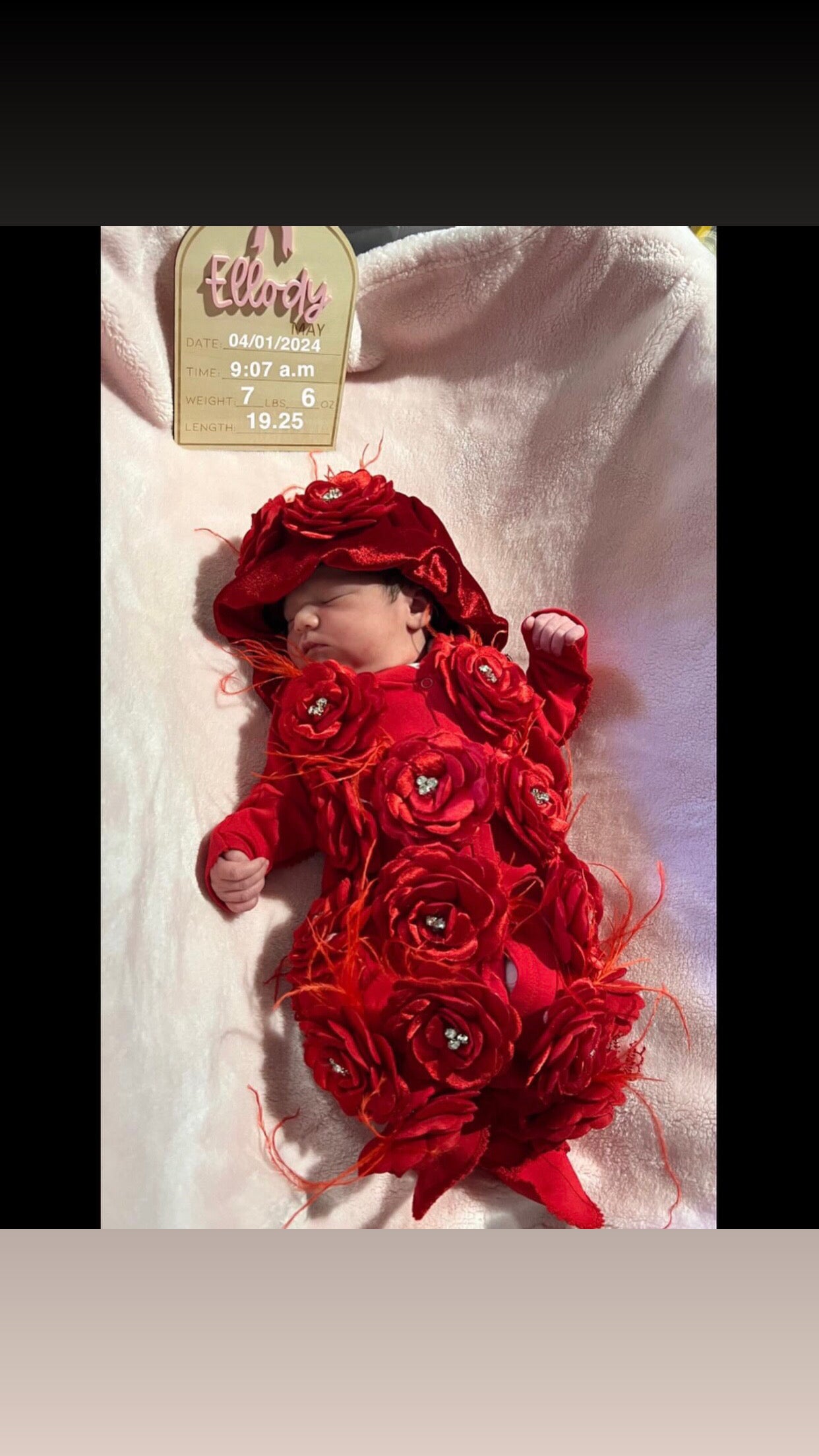 red baby jumpsuit flowers and bonnet