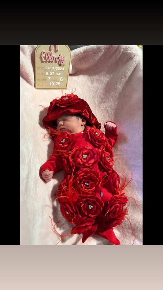 red baby jumpsuit flowers and bonnet