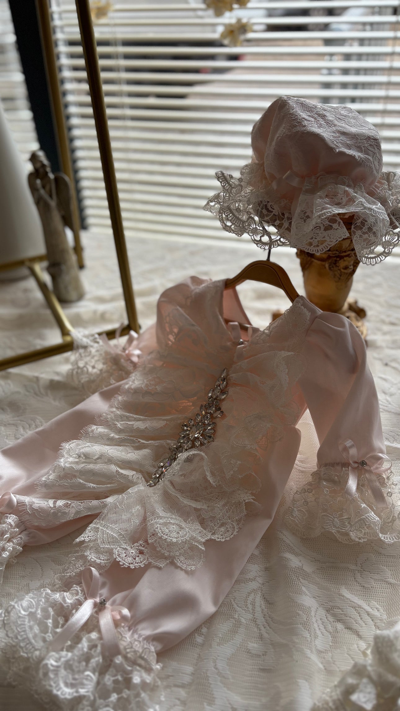 Pink baby jumpsuit and bonnet
