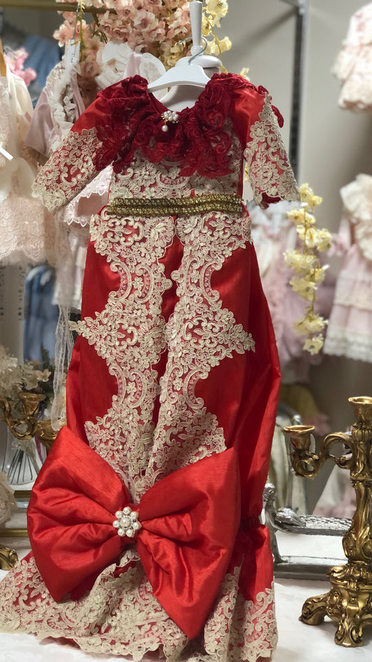 red baby gown and hair bow