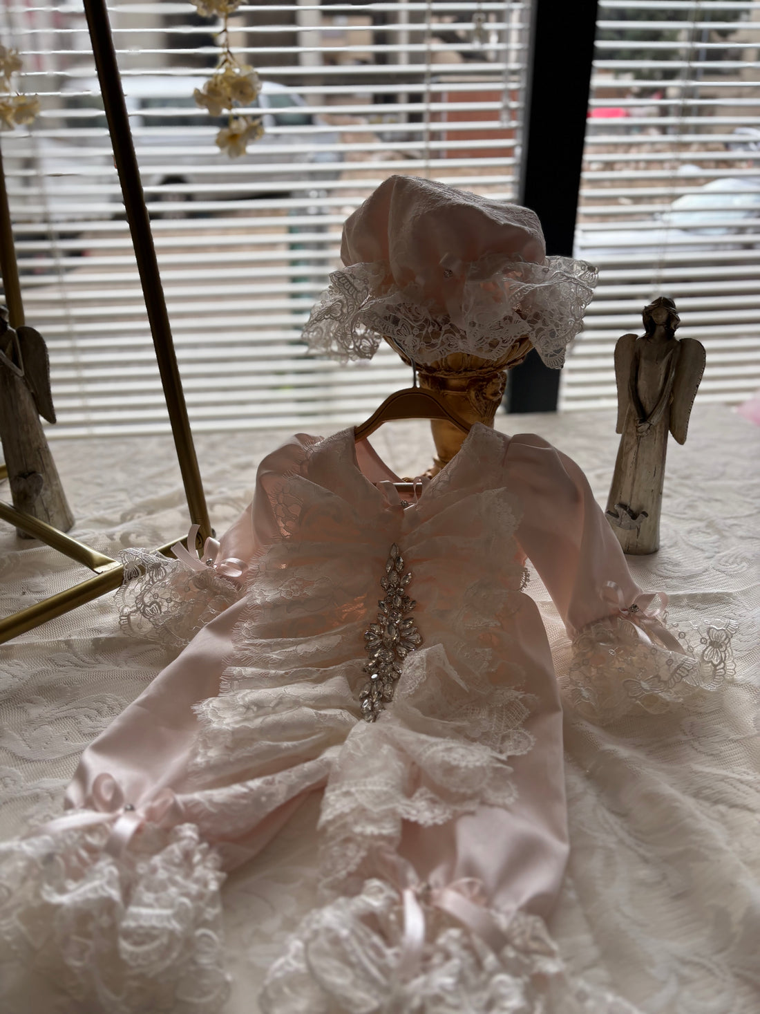 Pink baby jumpsuit and bonnet