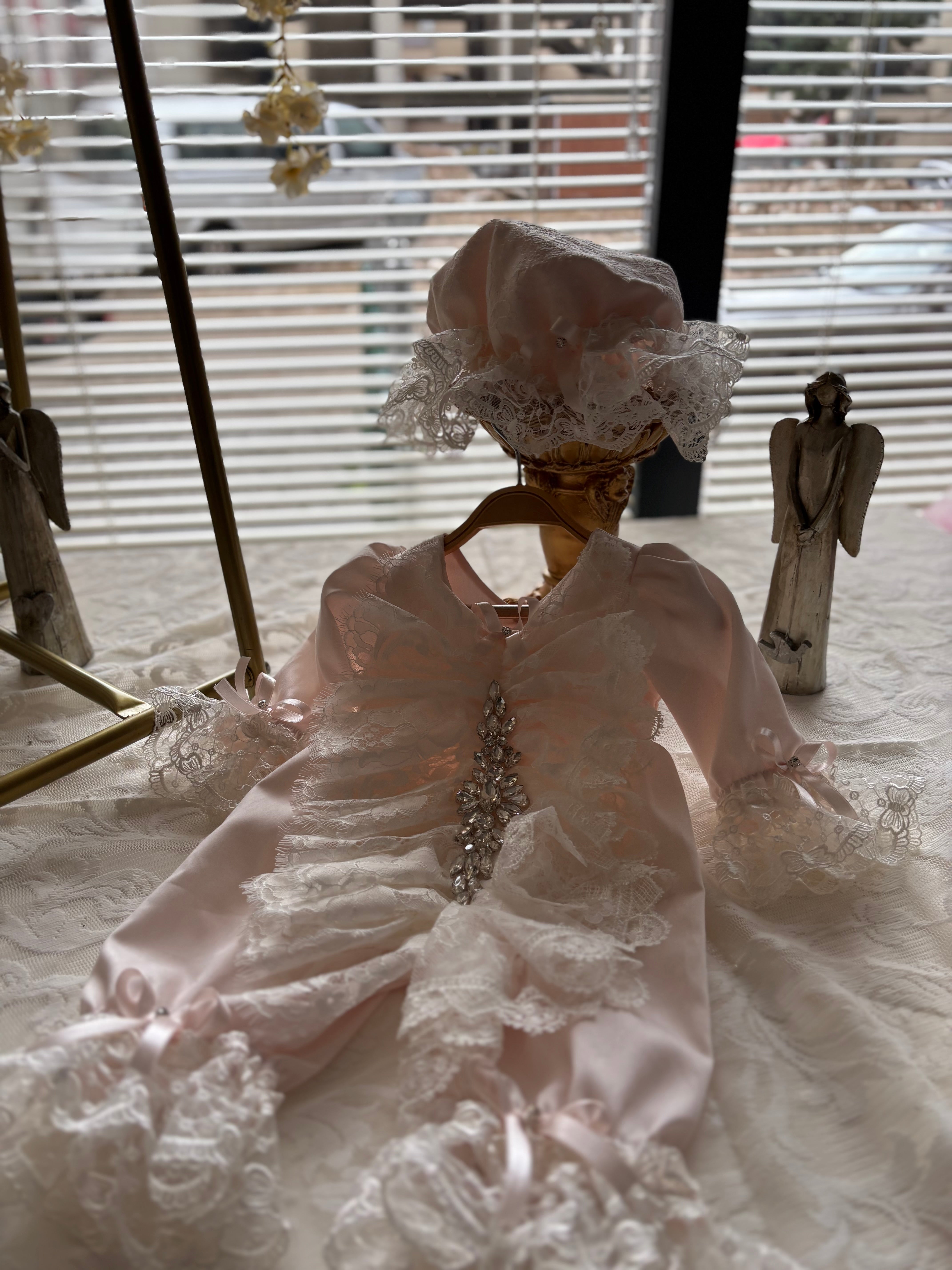 Pink baby jumpsuit and bonnet