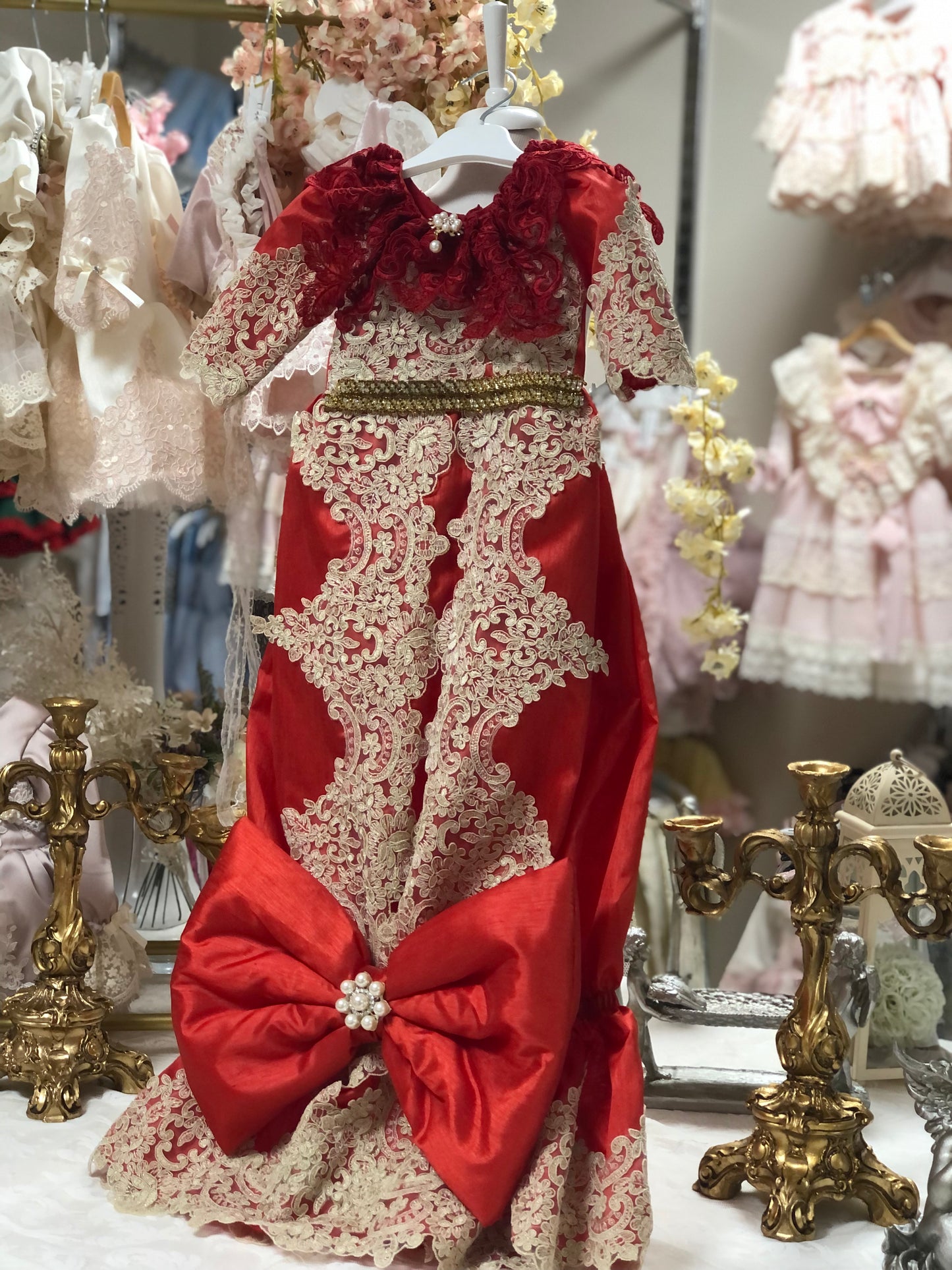 red baby gown and hair bow