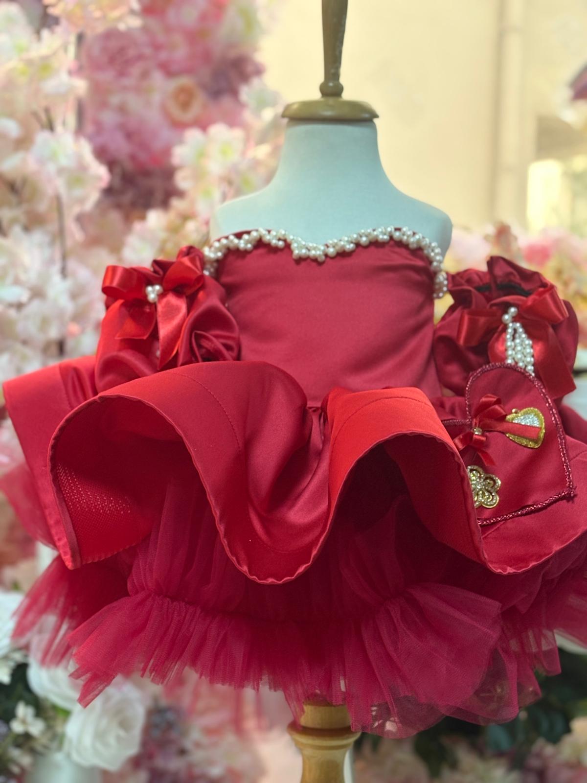 red satin puffy dress and hair bow