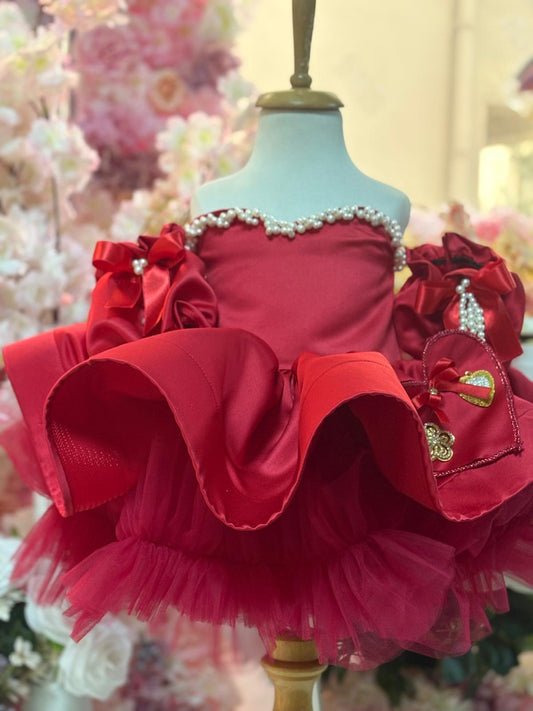 red satin puffy dress and hair bow